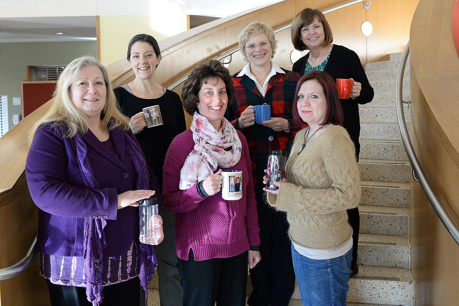 Current Green Team members, pictured here holding their reusable mugs, include, from left, Roslyn Carrier-Brault, Chemistry Department; Dawn Alger, Theater Department; Valerie Marinelli, College of the Environment; Liz Tinker, English Department; Anika Dane, Molecular Biology and Biochemistry Department; and Blanche Meslin, Biology Department.