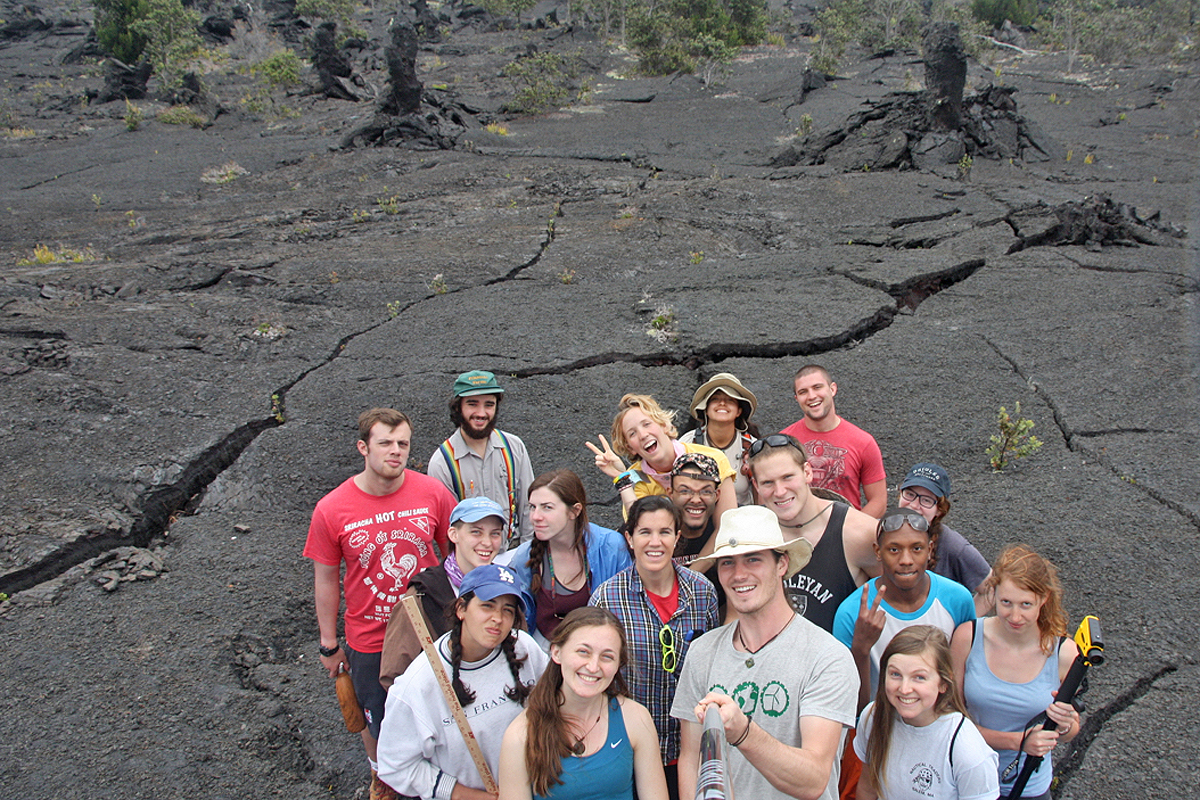 Students who are enrolled in the E&ES 397/398 Senior Seminar and Senior Field Research Project Capstone spent eight days conducting research in Hawaii. Pictured, the students gather on a lava tree field.