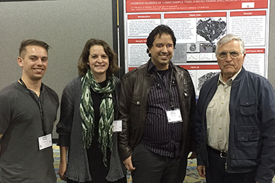 From left, graduate student Ben McKeeby, Melissa Lowe ’17 and graduate student Shaun Mahmood met Harrison "Jack" Schmitt, the only geologist to go to the moon. Schmitt collected collected the samples that Lowe and Mahmood were presenting on at this meeting.