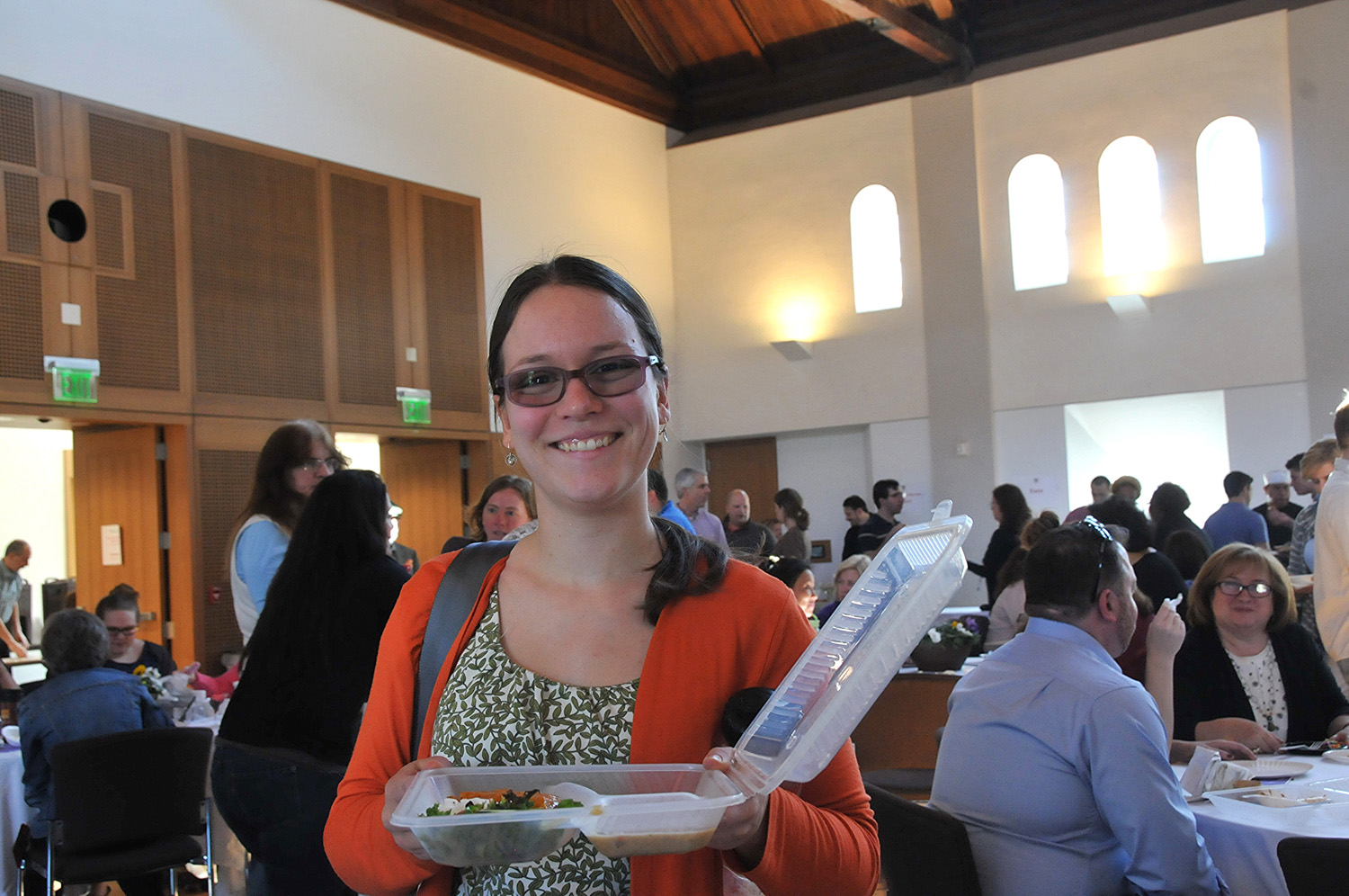 Sustainability Director Jennifer Kleindienst collected food in a reusable clamshell container, part of Wesleyan's sustainability efforts to reduce waste.