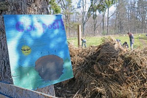 Wesleyan students oversee Long Lane Organic Farm's compost area.