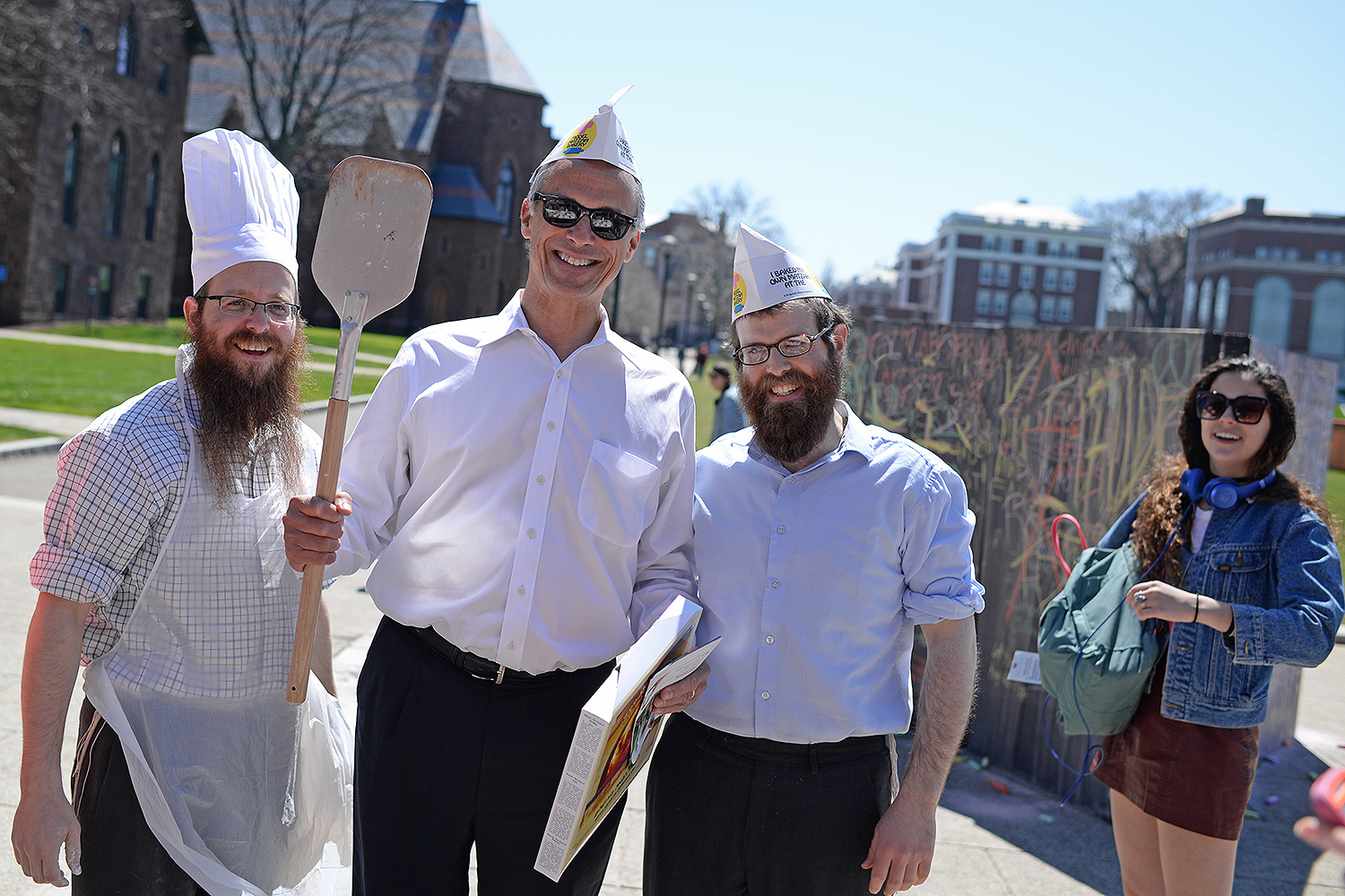 Wesleyan President Michael Roth, center, participated in the matzo bread making. 