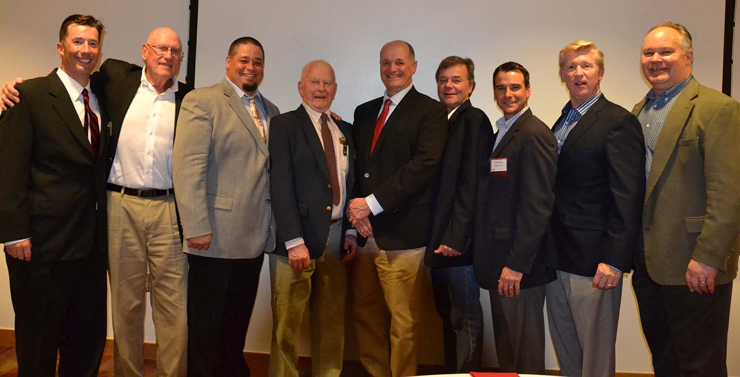 The Class of 2016 Wesleyan Baseball Hall of Fame, flanked by Baseball Coach Mark Woodworth ’98 on the right and Athletic Director Mike Whalen ’83 on left: Phil Rockwell ’65, MALS ’73 P’11; Jesse Carpenter ’96; Tom Young ’59, MALS ’73; Steve Donovan ’83, Todd Mogren ’83, Christian Frattasio ’00, Kevin Rose ’78.