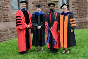 Wesleyan President Michael Roth honored James Lipton, professor of computer science; Demetrius Eudell, professor of history; and Sally Bachner, associate professor of English with Binswanger Prizes for Excellence in Teaching during the 184th Commencement Ceremony on May 22. (Photo by John Van Vlack)