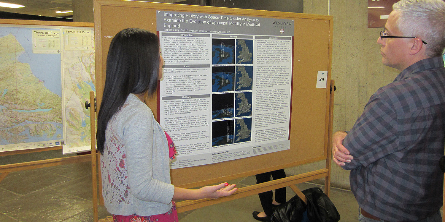 Stephanie Ling '16 explains her prize-winning poster to a conference participant. Ling worked with Wesleyan Professor Gary Shaw on the study, titled "Integrating History with Space-Time Cluster Analysis to Examine the Evolution of Episcopal Mobility in Medieval England."
