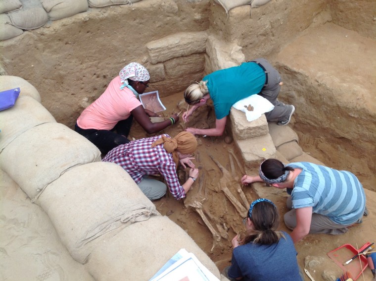 Birney, top right, and fellow researchers work to remove skeletons from the cemetery. Bone samples taken from the site are undergoing DNA testing. Pictured at left, stones were robbed from the chamber after going out of use. 
