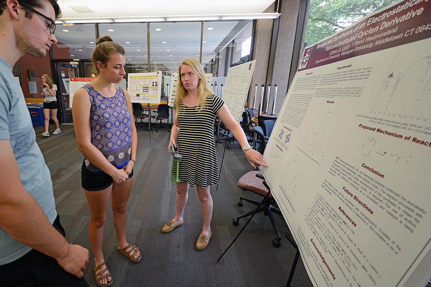 Colleen Lynch ’19 speaks to her peers about her study titled “Design and Synthesis of an Electrostatically Neutral Tetra-substituted Cyclen Derivative.” Her advisor is T. David Westmoreland, associate professor of chemistry, associate professor of integrative sciences. 