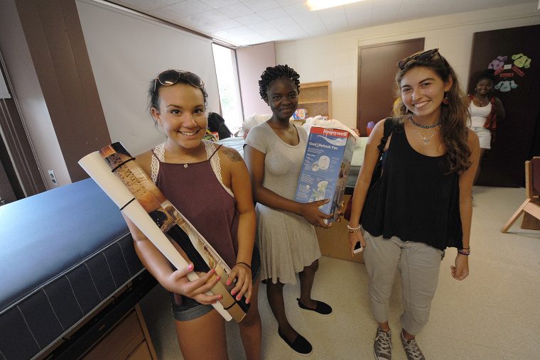 Cassie Morales ’20 from Oceanport, NJ, Malika Ilboudo ’20 from the Bronx, and Shiri Benmoshe ’20 from Manhattan begin unpacking and rearranging furniture with help from their families.