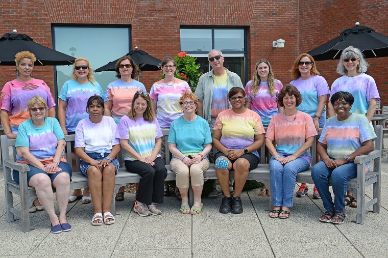 Wesleyan University staff sport their tie-dye t-shirts, Aug. 12, 2016.