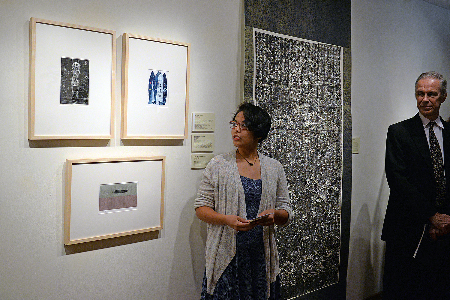Erin Deleon ’17 speaks about an aluminum lithograph titled “Carry the Stars (2013).” The artist, Ryoji Suzuki, is known for his beautiful line work combined with stark, unsettling imagery. 