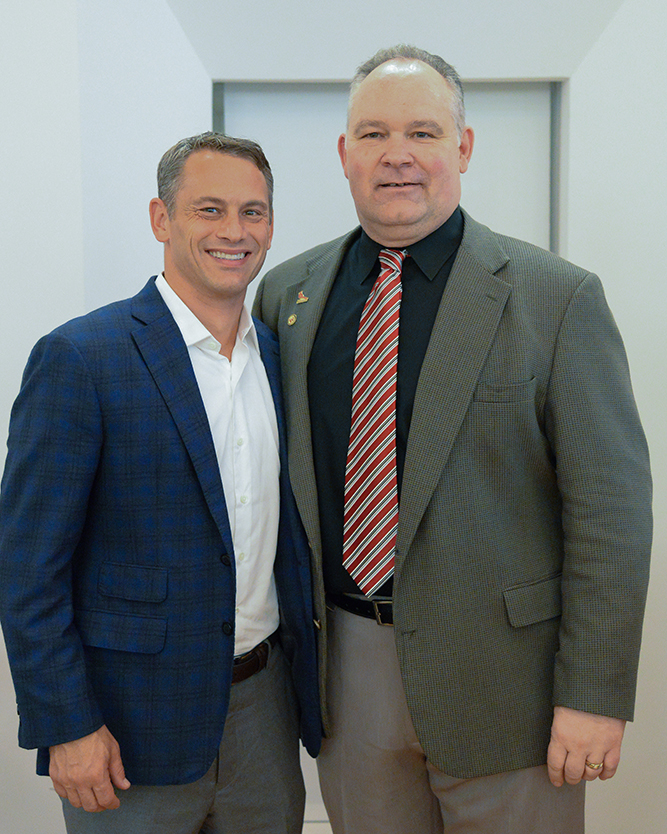 Jed Hoyer ’96, Chicago Cubs Executive Vice President/General Manager with Director of Athletics Mike Whalen ’83 at the 2016 Athletics Hall of Fame dinner at Wesleyan during Homecoming Weekend. 