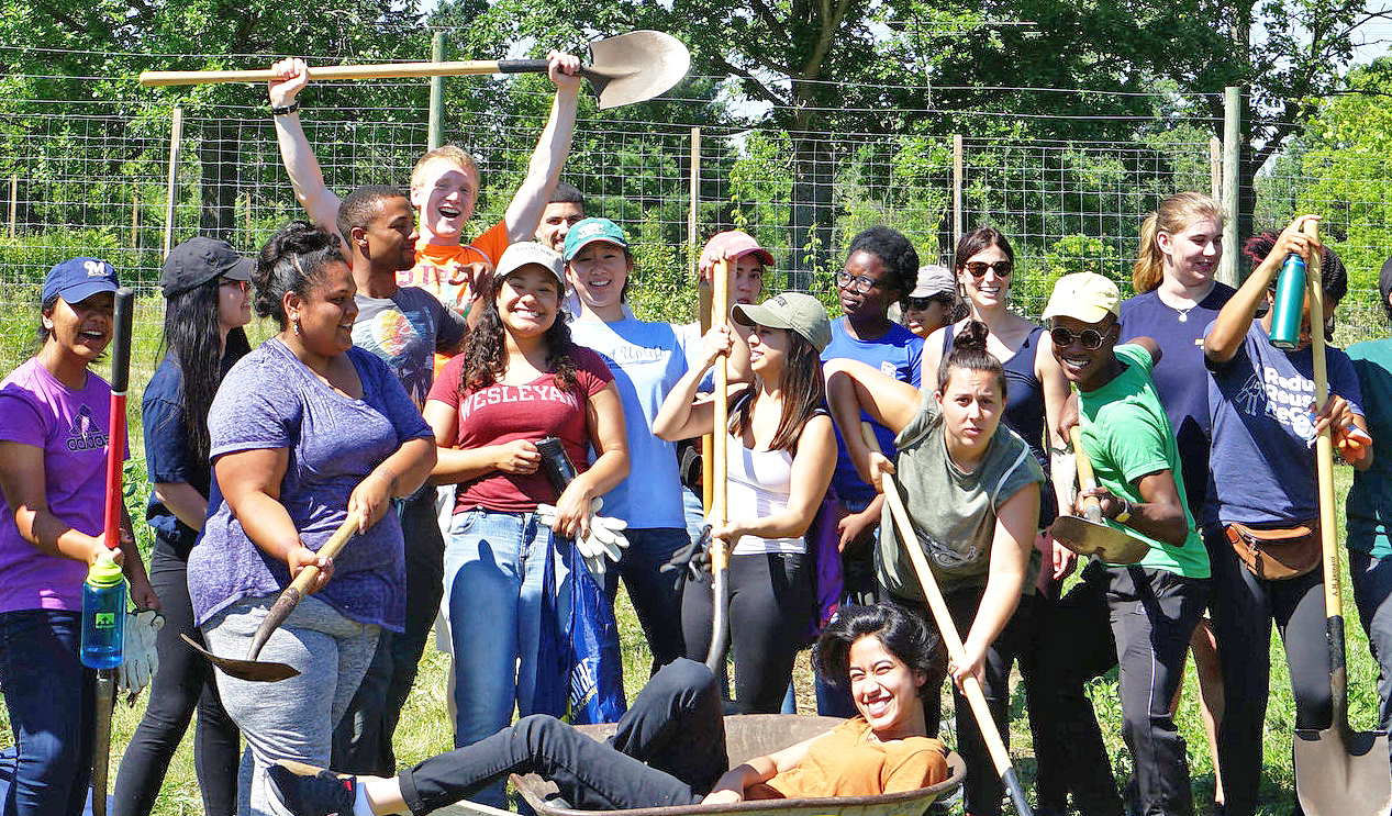 Kelly Lam ’19 (second from left), Ryan Nelson '19 (back row with shovel), Gabby Vargas ’18 (front row in Wesleyan t-shirt) and Emily Murphy ’18 (green hat) participated in the Doris Duke Conservation Scholars Program this summer at the University of Michigan. The students will return next summer to complete their second segment of the research program.