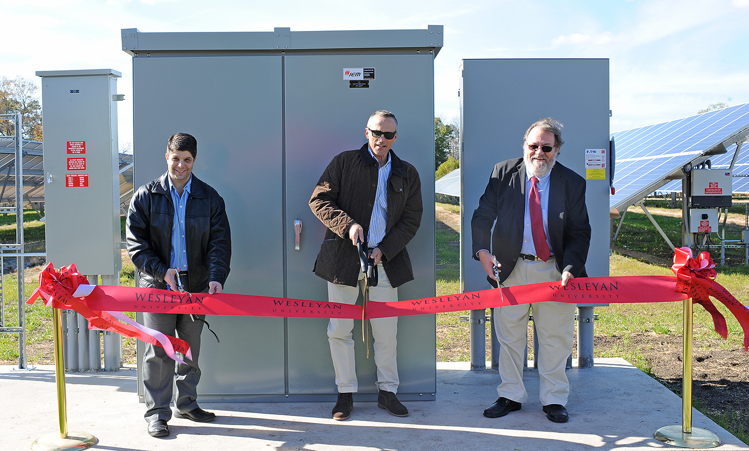 City of Middletown Mayor Daniel Drew, Wesleyan President Michael Roth, and former Vice President for Finance and Administration John Meerts participated in a ribbon-cutting ceremony Nov. 1 for Wesleyan's new photo 