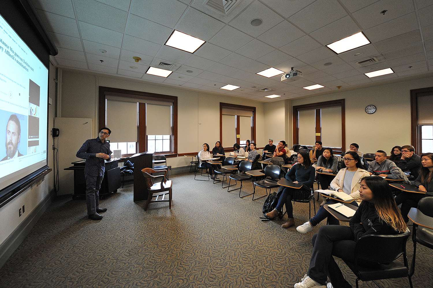 Long Bui, visiting assistant professor of American studies, teaches his AMST 220 Asian Americans and Pop Culture class on Jan. 27 in Fisk Hall, the first class of the Spring Semester. Throughout the semester, students will explore the history and experiences of Asian Americans through the site of popular culture, which includes films, comics, television, music and digital culture. 