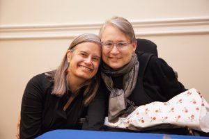 Christina Crosby, right, pictured with her partner Janet Jakobsen at a March 2015 event at Barnard College focused on Crosby's memoir, "A Body Undone: Living On After Great Pain."