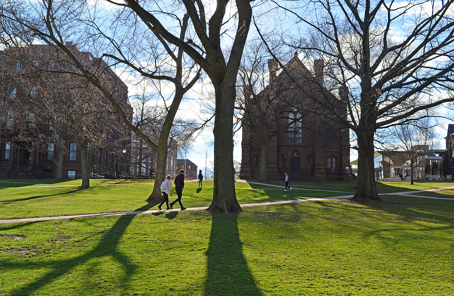 The sun casts long shadows on College Row, April 5. 