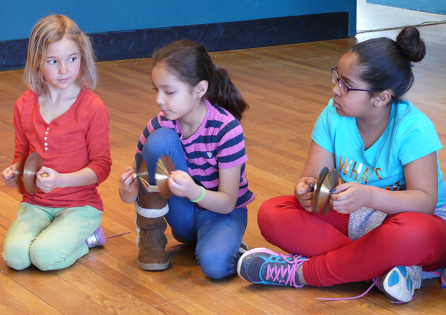 For many of the students, it was their first introduction to music theory and the complex layers of participation involved in creating an ensemble. The children began by learning about basic note values, such as the difference between a whole note and a half note, then moved into practicing rhythmic pattern exchanges, and ended by performing together as a percussion band.