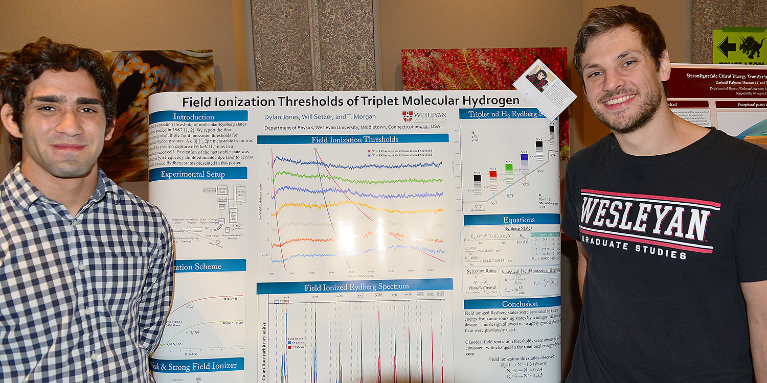 At left, Dylan Jones ’19 and graduate student Will Setzer shared their physics research on “Ionization Nature of Tri-state Rydberg H2 Molecules.” Their advisor is Tom Morgan, the Foss Professor of Physics. 