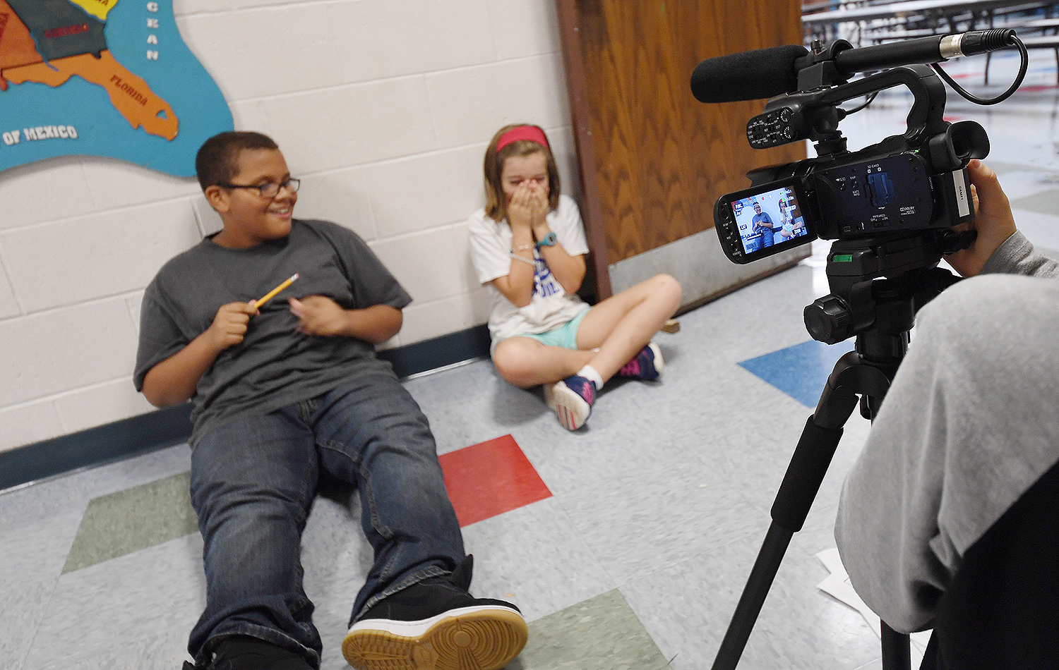 Fifth grader Matthew and Violet act out a scene in which Matthew steals the pencil and Violet is upset. Fifth grader Matthew and Violet act out a scene in which Matthew steals the pencil and Violet is upset. 