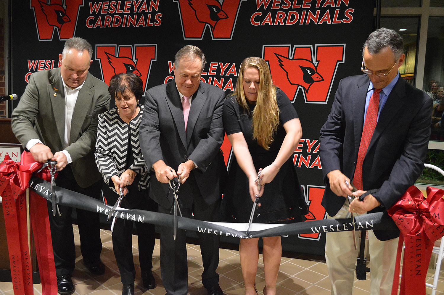 Bill and Amanda Belichick joined Whalen, Morea and Wesleyan President Michael Roth in a ribbon cutting ceremony to officially acknowledge the inside the newly-named Belichick Plaza