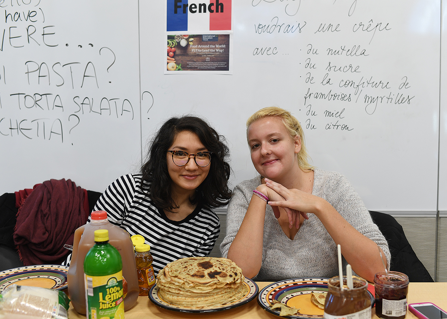 Participants learned how to say phrases in a respective language (Spanish, French, Italian and Arabic) in order to receive the food. Representatives of France served crepes. 