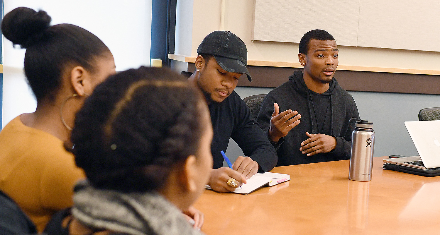 At right, Nate Taylor ’18 speaks about his social enterprise, Nate Taylor Coaching. At his left is Jaylen Berry ’18, founder and executive director of The Jaylen D. Berry Foundation.