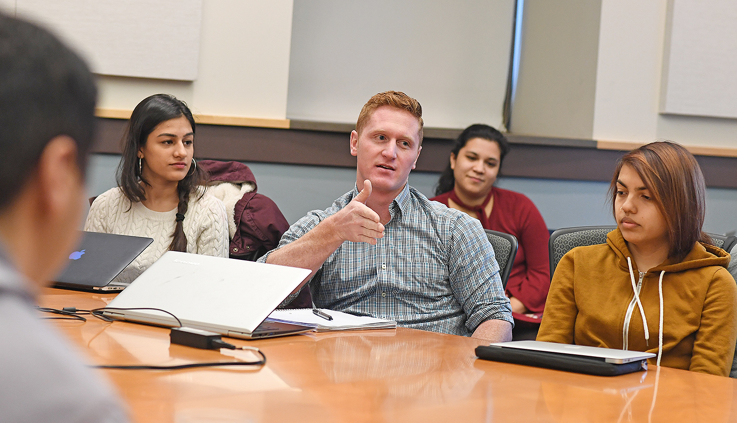 Wesleyan Posse Fellow Lance Williams ’20 speaks about his role with the Wesleyan Design Tank, which uses human-centered design methodologies to facilitate problem-solving locally. Sankriti Malik ’20, at left, also is involved with the Design Tank. Pictured in back is Rhea Drozdenko ’18, the 2017/2018 Civic Engagement Fellow, and at right is Kelly Acevedo ’20 who is creating Caput Productions through the Patricelli Center. 