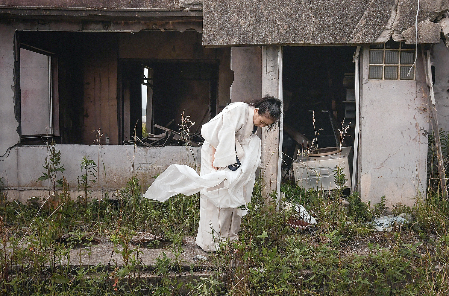 On June 27, 2017 Eiko performed near the wreckage of a home four miles north of the Fukushima Daiichi Disaster. The home, and the surrounding vibrant neighborhood, was destroyed by the tsunami and then inundated with radioactivity from the Daiichi plant.