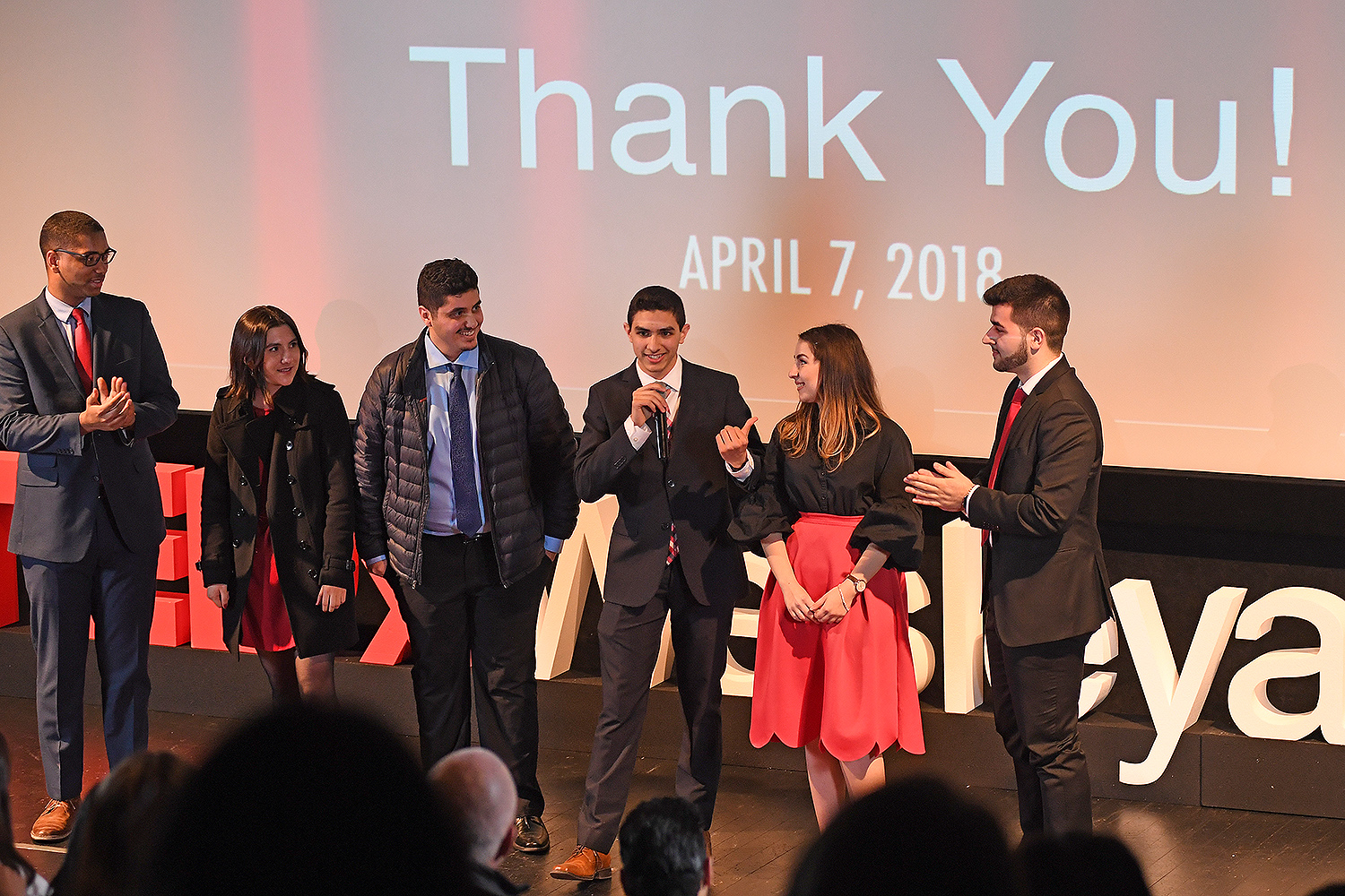 At left, Anthony Price '20, Zoe Reifel '21, Thafir Elzofri '19, Eunes Harun '20, Melisa Olgun '20 and Leo Merturi '20 thank the audience for attending Wesleyan's TEDxWesleyanU event on April 7.