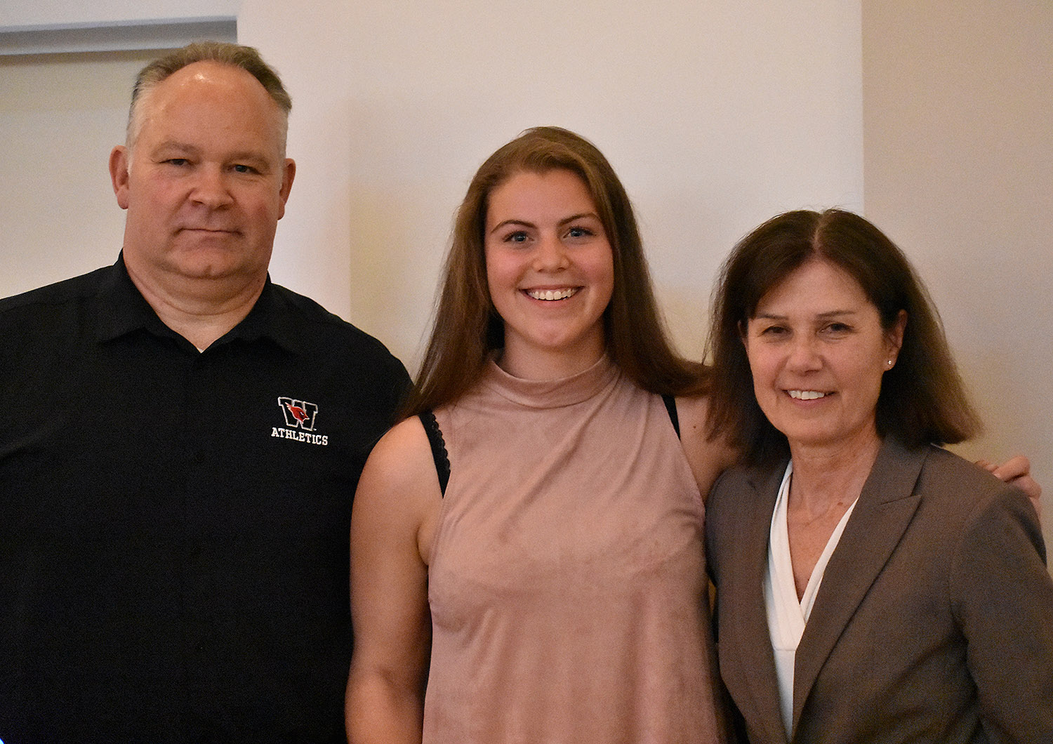Basketball player Maddie Bledsoe '18 also received the Maynard Award. She is pictured with Whalen, left, and Kate Mullen, head women's basketball coach, right.
