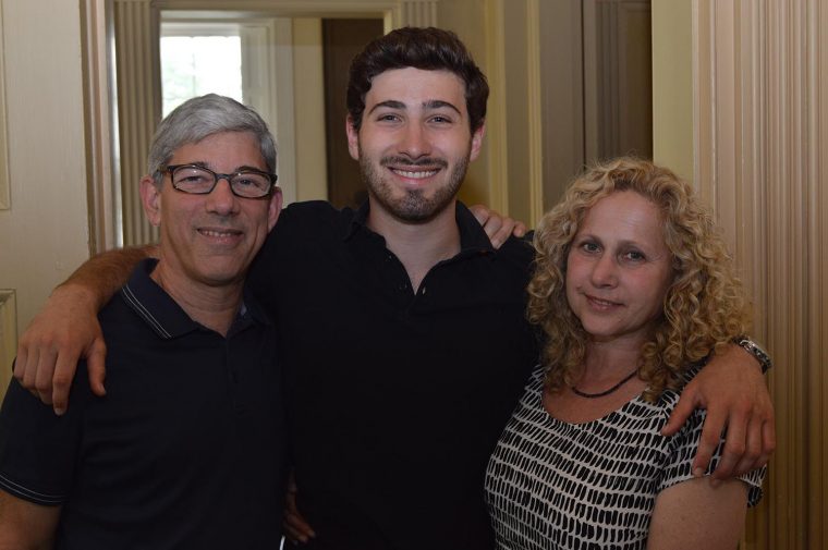 Aaron Stagoff-Belfort '18, pictured with his parents, was co-editor-in-chief of the Argus in Fall 2017 and helped organize the 150th celebration.