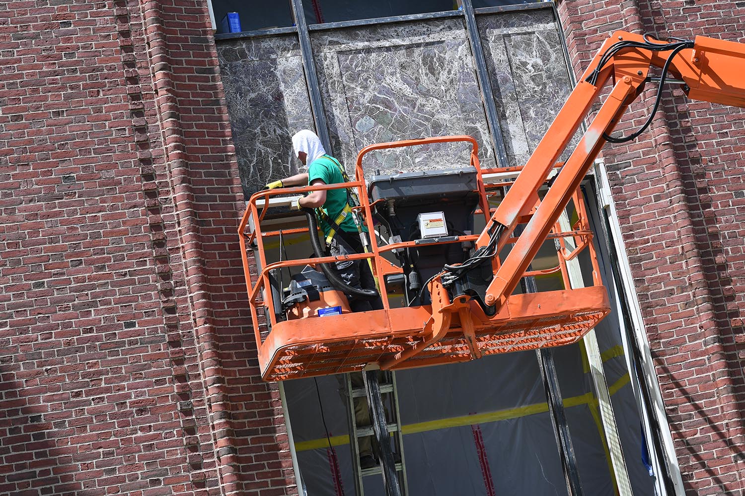 This summer, crews are working on restoring and repairing windows at Olin Library.
