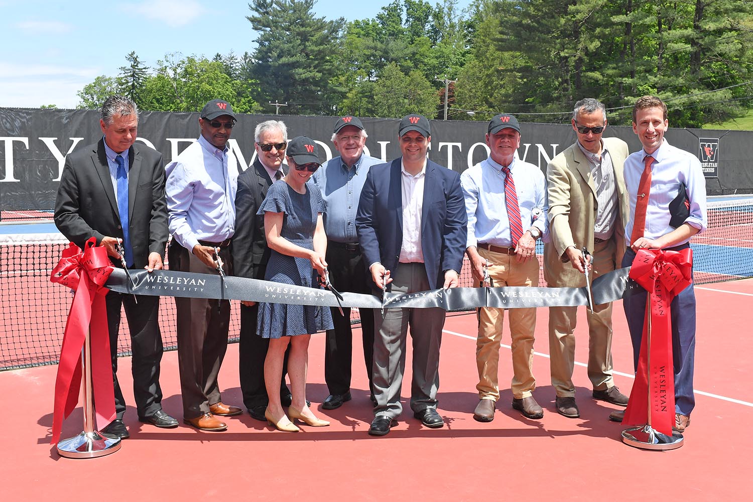 In 2017, Wesleyan and the City of Middletown partnered together on a project to rehabilitate and upgrade the Vine Street Tennis Courts. And on June 8, the courts were officially re-dedicated during a ribbon-cutting ceremony. Participants included William Russo, director of Middletown Public Works; Lorenzo Marshall, Middlesex Chamber of Commerce; Seb Giuliano, Common Council; Cathy Lechowicz, director of recreation and community services for the City of Middletown; Gerald Daley, Common Council; Daniel Drew, Mayor; Eugene Nocera, Common Council' Wesleyan President Michael Roth and State Representative Matt Lesser ’10. 