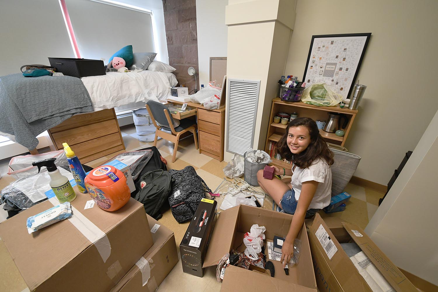 Cambria Weaver '22 from Santa Barbara, Calif. sets up her room in the Butterfields. Weaver learned about Wesleyan from alumni. “All were into different things and they were each very passionate about what they were doing," she said. 