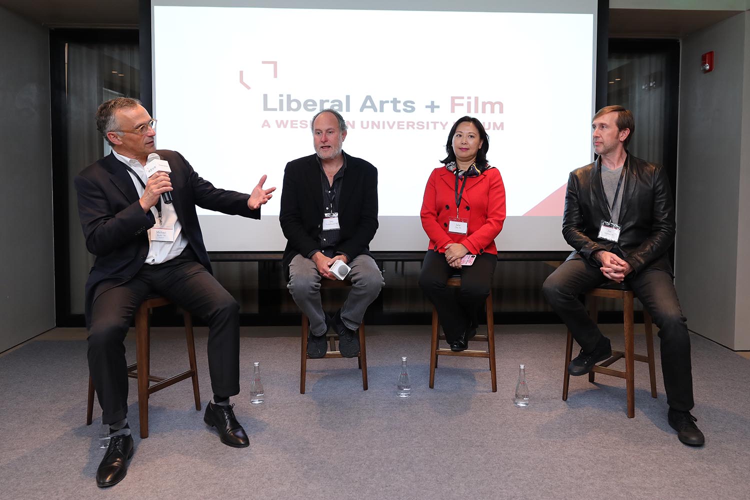 President Michael Roth moderated a discussion with alumni in the entertainment field, from left, Jon Turteltaub '85, Julia Zhu '91, and Jon Hoeber '93, on "practical idealism in action" at the inaugural Liberal Arts + forum in Shanghai on Oct. 20.