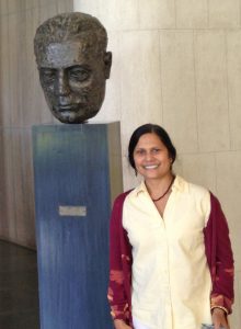 Ishita Mukerji with the bust of Dr. Homi Bhabha, founder of the Tata Institute for Fundamental Research.
