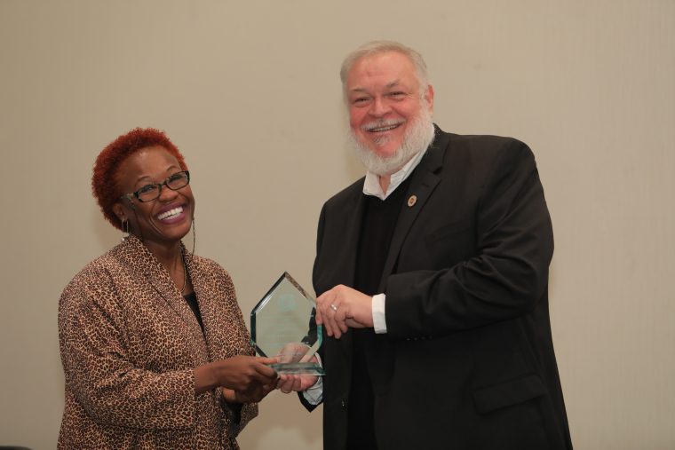 Gina Athena Ulysse accepted the Anthropology in Media Award (AIME) from American Anthropological Association President Alex Barker in November.
