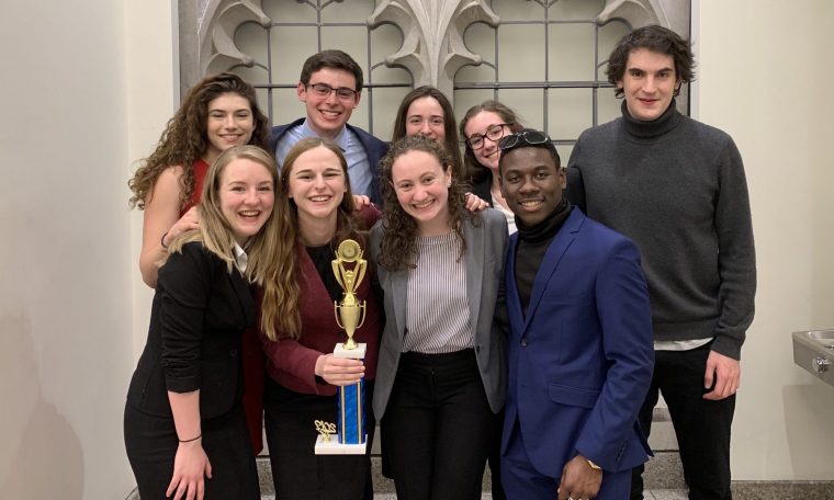 Wesleyan's Mock Trial A Team poses with their National-qualifier trophy at the Chestnut Hill Opening Round Championship Series in March 2019. The team is ranked 25th in the country.
