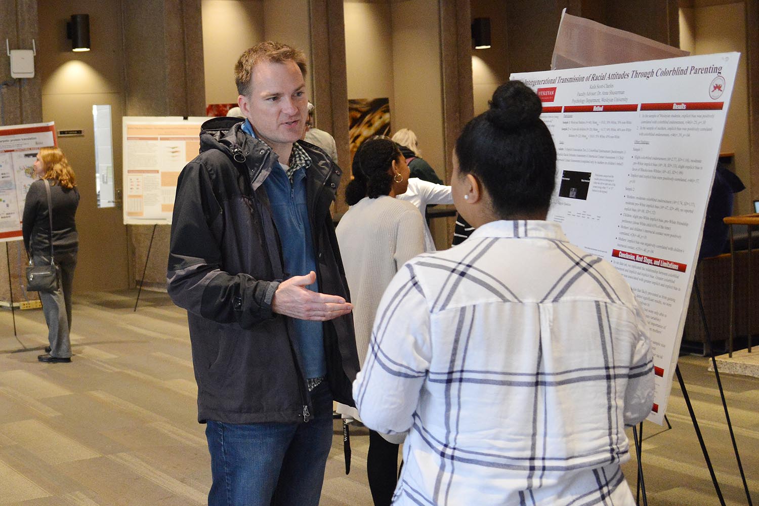 Seth Redfield, chair and associate professor of astronomy, speaks to Kaila Scott '19 about her study titled "The Intergenerational Transmission of Racial Attitudes: The Effects of Colorblind Parenting." Scott's advisor is Anna Shusterman, associate professor of psychology.