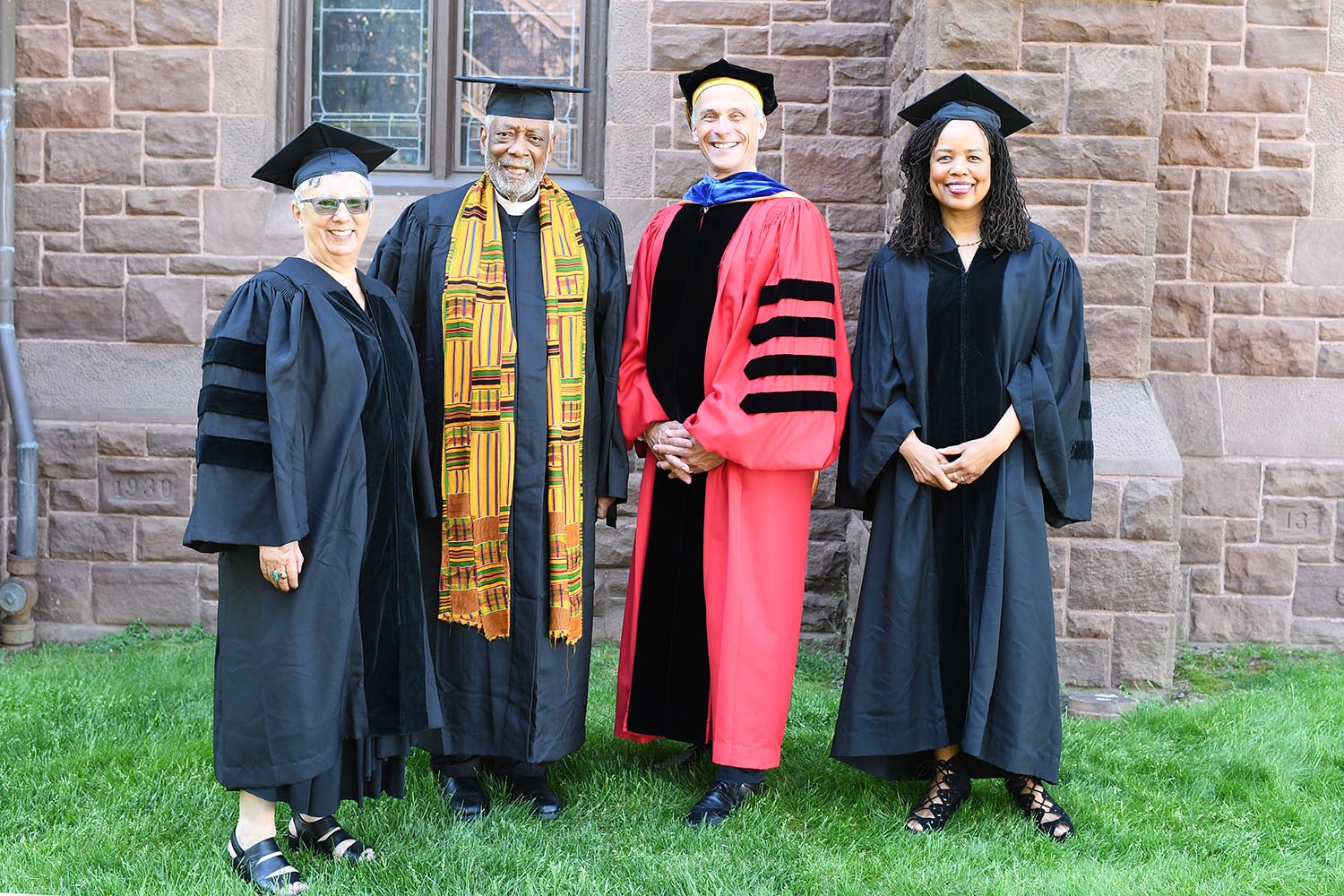 Wesleyan President Michael Roth ’78 and Board of Trustees Chair Donna Morea congratulate honorary degree recipients Saidiya Hartman ’84, Hazel Carby, and Edwin Sanders II ’69 at Wesleyan's 187th Commencement.
