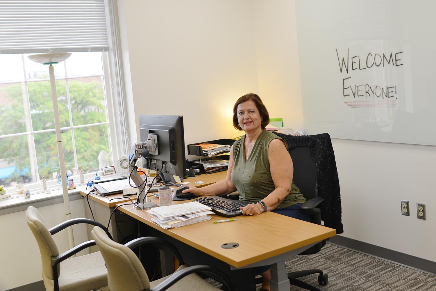 Olga Bookas, director of purchasing, enjoys her new office on the third floor. 