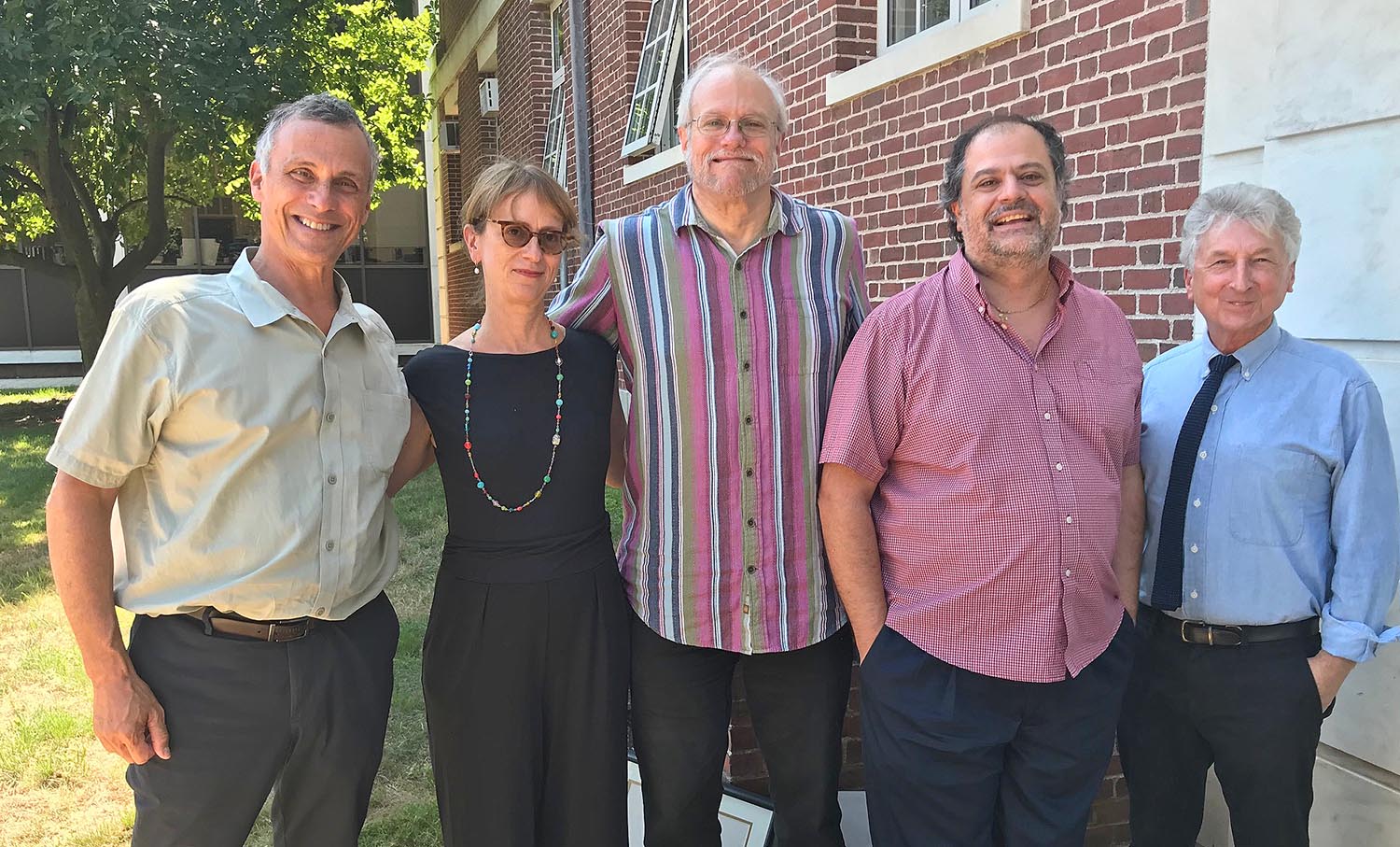 Wesleyan President Michael Roth, left, and Interim Provost and Senior Vice President for Academic Affairs Rob Rosenthal, right, congratulate the three recipients of the second annual Faculty Research Prize. They include Natasha Korda, professor of English; Joseph Rouse, the Hedding Professor of Moral Science; and Tsampikos Kottos, the Lauren B. Dachs Professor of Science and Society.