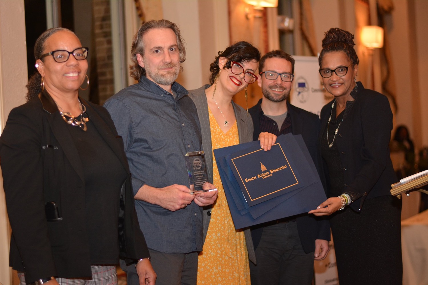 From left, Cheryl Sharp '90, deputy director of the Connecticut Commission on Human Rights and Opportunities (CHRO); Jason Torello, Center for Prison Education alumnus; Allie Cislo, CPE program manager; Daniel McGloin, CPE academic development and planning manager; and Tanya Hughes, CHRO executive director at the 2019 Leaders and Legends award ceremony on Nov. 21.