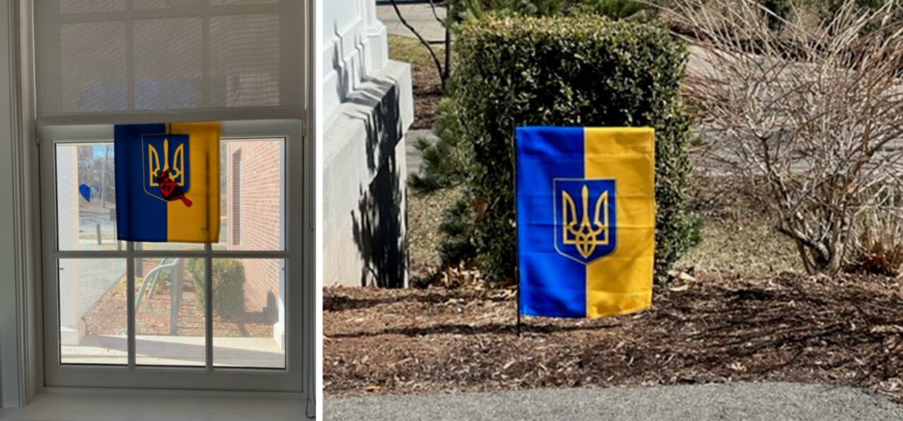 When administrative assistant Ryan Launder saw the COE's flag, she felt inspired to display another one outside the Shapiro Writing Center. The winds proved too strong, however, so instead, she hung the flag inside the center facing out the window. (Photos by Ryan Launder)